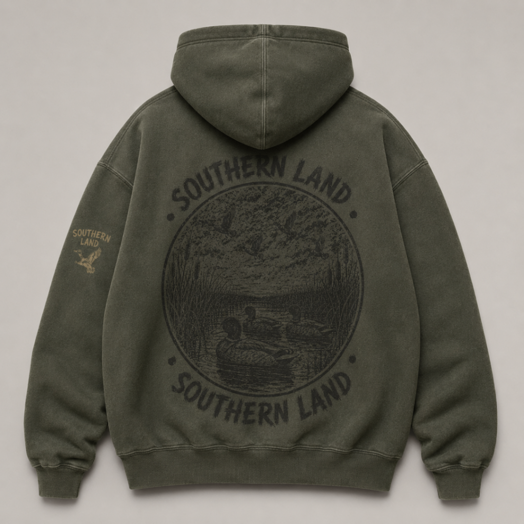 Backwater Hoodie in faded moss with a tonal marsh circle print across the back